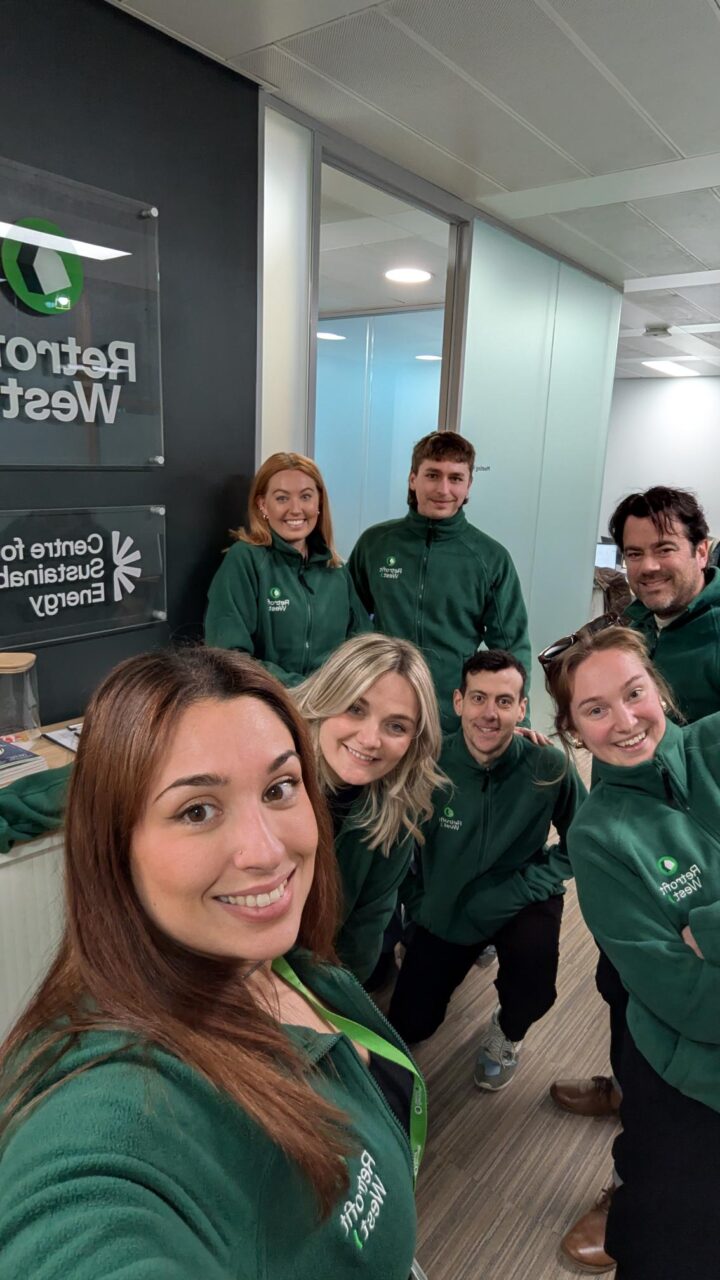 The Retrofit West team in green branded fleeces