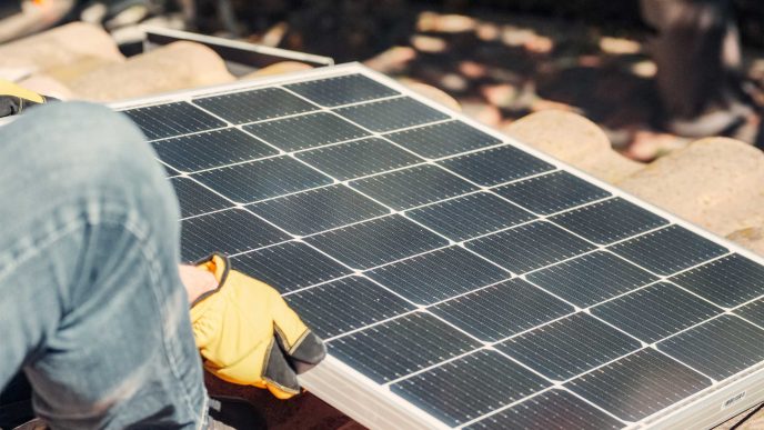 Solar panel's getting installed on the roof of a house - Retrofit West