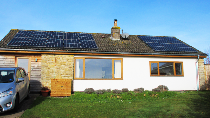 bungalow with solar panels on the roof