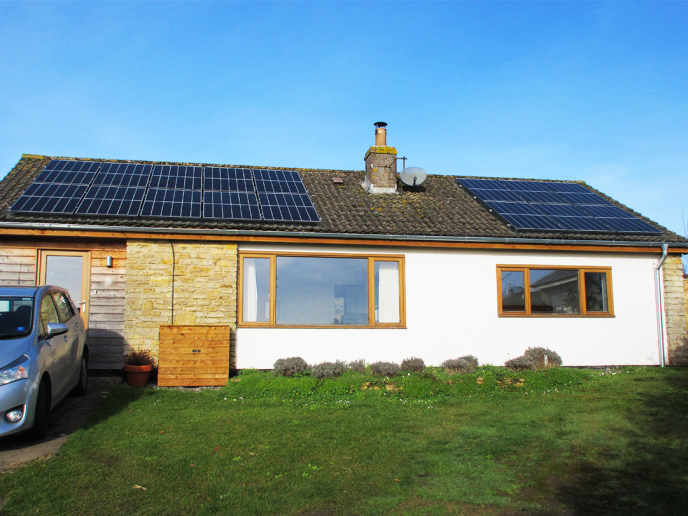 bungalow with solar panels on the roof