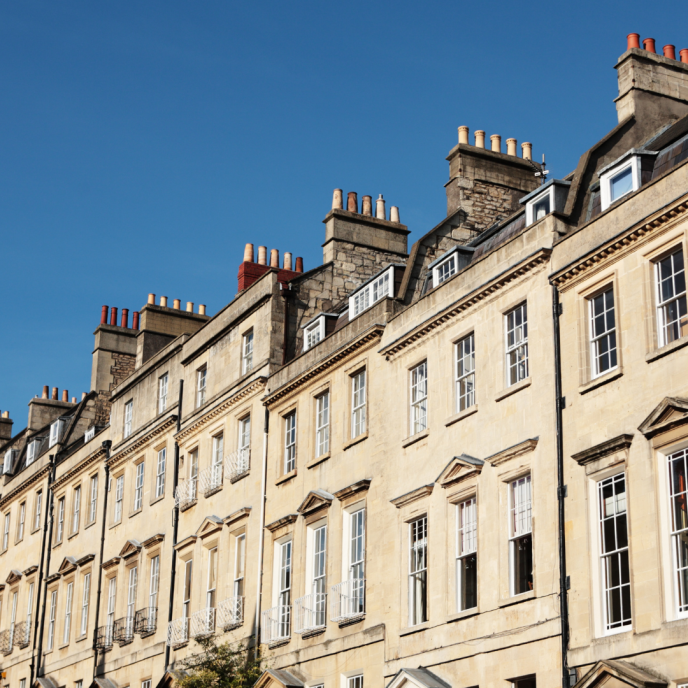 sandstone Bath buildings in a row with a blue sunny sky