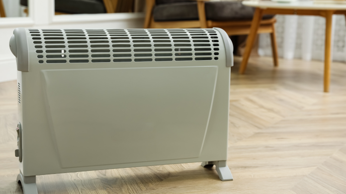 an electric heater on a wooden floor