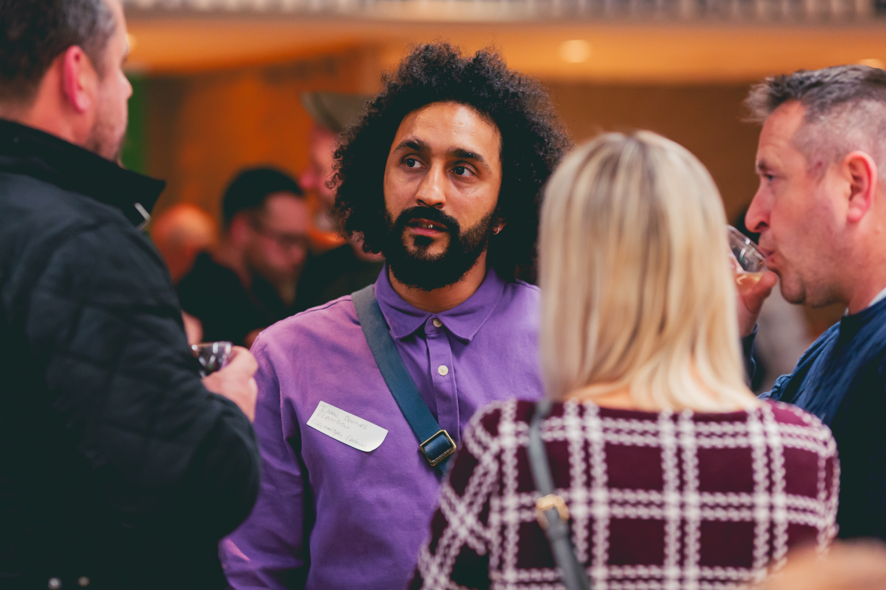 People discussing in a group at a networking event