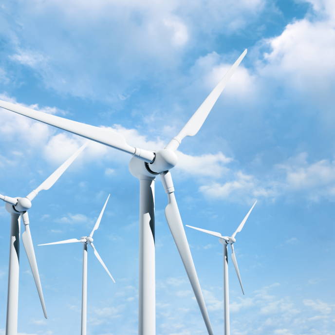 a bright sunny day with wind turbines.