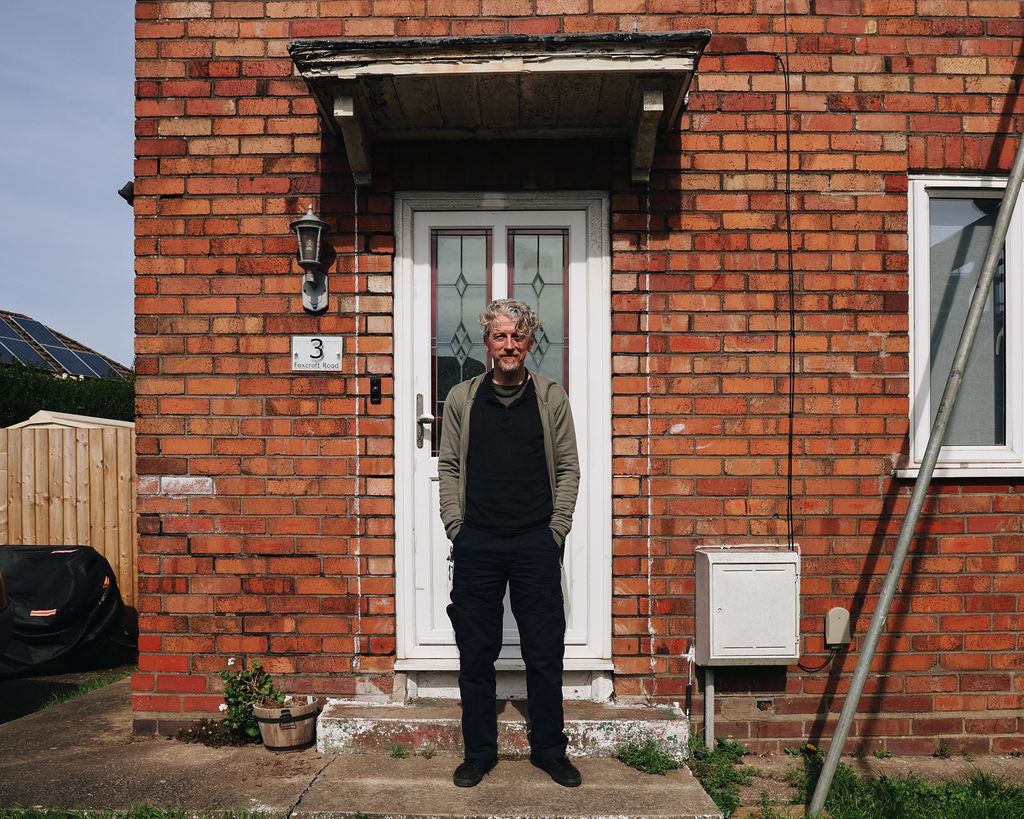 kirk stood outside his front door smiling