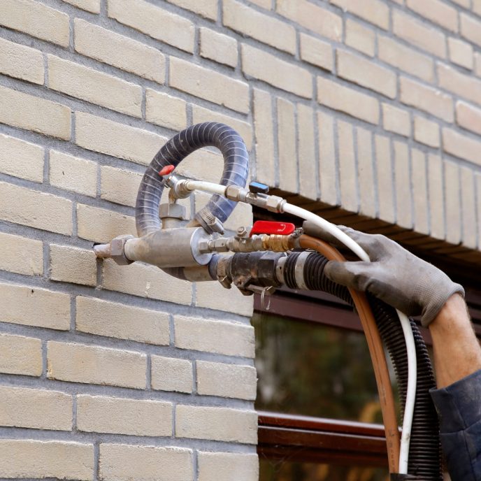 house being insulated with cavity wall insulation beads