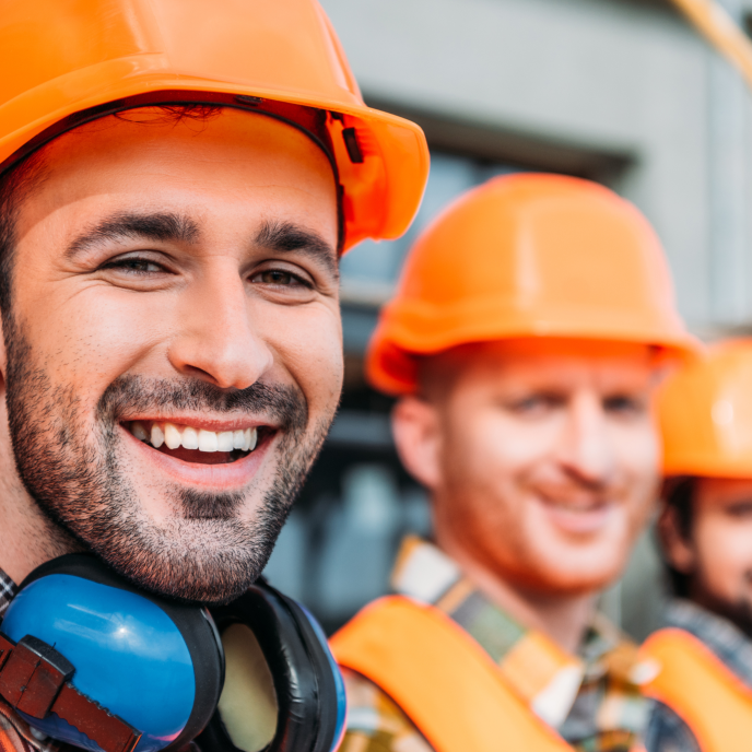 Three tradesman in hardhats and hi-vis - Retrofit West